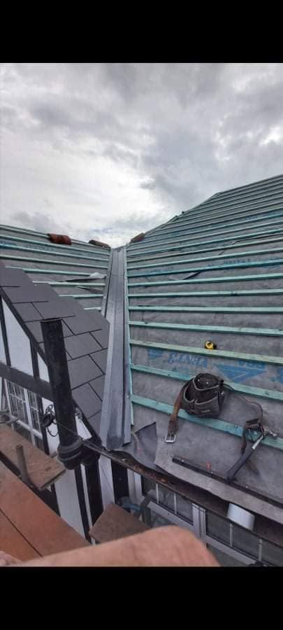 A lead hip being fitted mid re-roof, on new membrane and battens